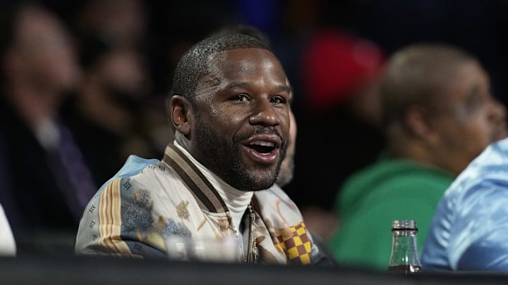 Dec 14, 2024; Las Vegas, Nevada, USA; Floyd Mayweather looks on during the first half between the Milwaukee Bucks and the Atlanta Hawks in a semifinal of the 2024 Emirates NBA Cup at T-Mobile Arena. Mandatory Credit: Kyle Terada-Imagn Images Dec 14, 2024; Las Vegas, Nevada, USA; Floyd Mayweather looks on during the first half between the Milwaukee Bucks and the Atlanta Hawks in a semifinal of the 2024 Emirates NBA Cup at T-Mobile Arena. Mandatory Credit: Kyle Terada-Imagn Images