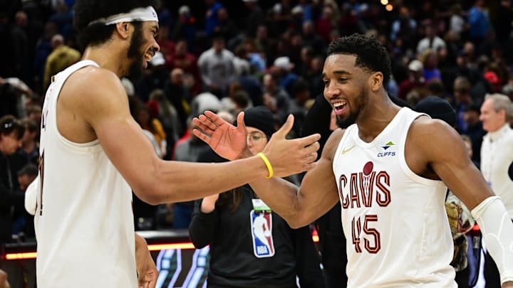 Jan 8, 2025; Cleveland, Ohio, USA; Cleveland Cavaliers guard Donovan Mitchell (45) celebrates with center Jarrett Allen (31) after the Cavaliers beat the Oklahoma City Thunder at Rocket Mortgage FieldHouse. Mandatory Credit: Ken Blaze-Imagn Images