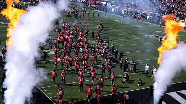 Cincinnati Bearcats run onto the field before the NCAA football game between the Cincinnati Bearcats and UCF Knights at Nippert Stadium in Cincinnati on Oct. 11, 2025. Cincinnati Bearcats run onto the field before the NCAA football game between the Cincinnati Bearcats and UCF Knights at Nippert Stadium in Cincinnati on Oct. 11, 2025.