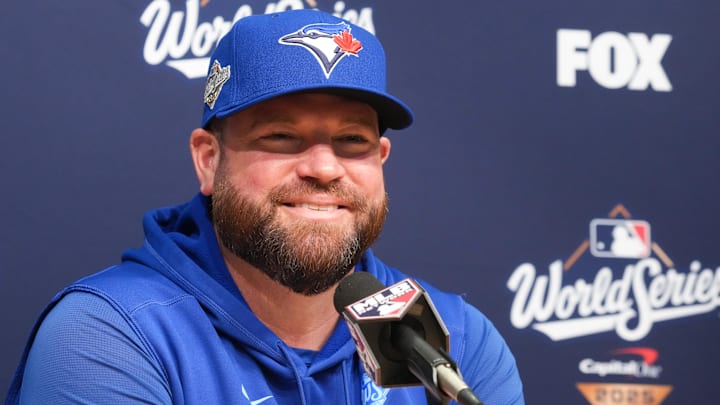 Oct 29, 2025; Los Angeles, California, USA; Toronto Blue Jays manager John Schneider (14) speaks at the pregame press conference before game five of the 2025 MLB World Series at Dodger Stadium. 