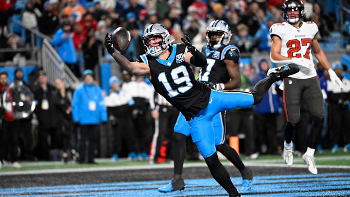 Dec 1, 2024; Charlotte, North Carolina, USA;  Carolina Panthers wide receiver Adam Thielen (19) attempts to catch the ball in the end zone in the second quarter at Bank of America Stadium. Mandatory Credit: Bob Donnan-Imagn Images