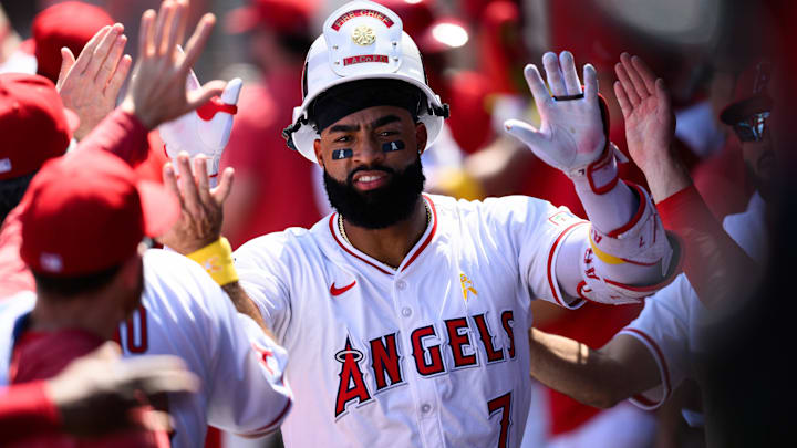 Sep 7, 2025; Anaheim, California, USA; Los Angeles Angels right fielder Jo Adell (7) is greeted by teammates after hitting a two run home run against the Athletics during the first inning at Angel Stadium. Mandatory Credit: William Liang-Imagn Images