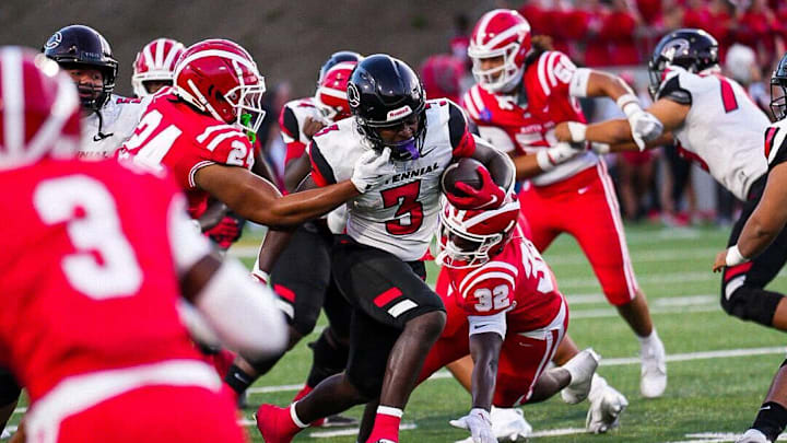 Corona Centennial running back bursts through the Mater Dei defense Corona Centennial running back bursts through the Mater Dei defense