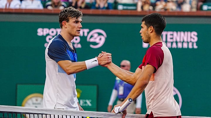 Jack Draper (left) shakes hands with Carlos Alcaraz after their semifinal match at the BNP Paribas Open in Indian Wells, Calif., Saturday, March 15, 2025.