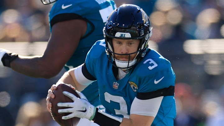 Jacksonville Jaguars quarterback C.J. Beathard (3) rushes for yards during the third quarter of a regular season NFL football matchup Sunday, Dec. 31, 2023 at EverBank Stadium in Jacksonville, Fla. 