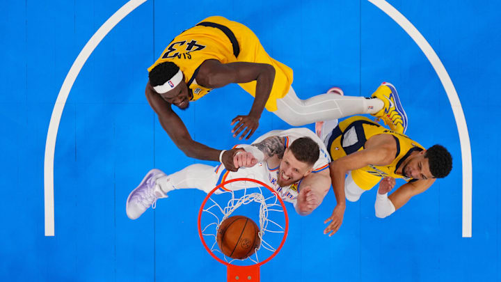 Jun 5, 2025; Oklahoma City, Oklahoma, USA; Oklahoma City Thunder center Isaiah Hartenstein (55) shoots against Indiana Pacers forward Pascal Siakam (43) and guard Tyrese Haliburton (0) during the second half during game one of the 2025 NBA Finals at Paycom Center. Mandatory Credit: Julio Cortez-Pool Photo via Imagn Images