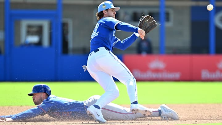 Ernie Clement catching the throw from the stolen base caught stealing attempt. 