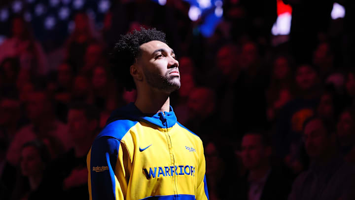 Golden State Warriors forward Trayce Jackson-Davis (32) during the national anthem before the game against the Denver Nuggets at Chase Center.