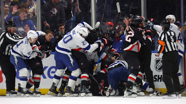 Apr 6, 2026; Buffalo, New York, USA;  The Buffalo Sabres and the Tampa Bay Lightning get in to a scrum after the whistle during the first period at KeyBank Center. Mandatory Credit: Timothy T. Ludwig-Imagn Images
