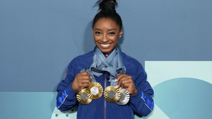 Aug 5, 2024: Simone Biles poses for a photo with her three gold and one silver medal after day three of the gymnastics event finals during the Paris 2024 Olympic Summer Games. Aug 5, 2024: Simone Biles poses for a photo with her three gold and one silver medal after day three of the gymnastics event finals during the Paris 2024 Olympic Summer Games.