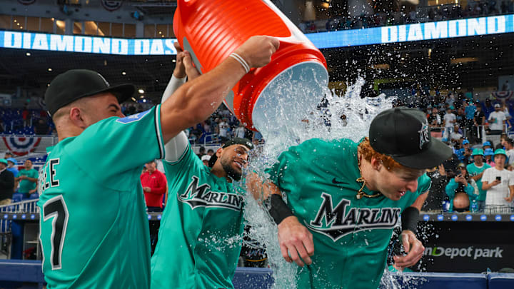 Mar 29, 2026; Miami, Florida, USA; Miami Marlins right fielder Owen Caissie (17) is doused with water by center fielder Jakob Marsee (87) and catcher Agustin Ramirez (50) after hitting a two-run walk-off home run against the Colorado Rockies during the ninth inning at loanDepot Park. Mandatory Credit: Sam Navarro-Imagn Images Mar 29, 2026; Miami, Florida, USA; Miami Marlins right fielder Owen Caissie (17) is doused with water by center fielder Jakob Marsee (87) and catcher Agustin Ramirez (50) after hitting a two-run walk-off home run against the Colorado Rockies during the ninth inning at loanDepot Park. Mandatory Credit: Sam Navarro-Imagn Images
