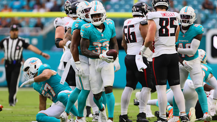 Aug 9, 2024; Miami Gardens, Florida, USA; Miami Dolphins cornerback Siran Neal (33) celebrates after recovering a fumble against the Atlanta Falcons during the first quarter at Hard Rock Stadium. Mandatory Credit: Sam Navarro-Imagn Images