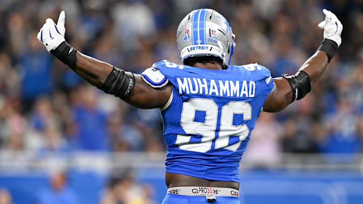 Detroit Lions linebacker Al-Quadin Muhammad (96) celebrates after a sack of Chicago Bears quarterback Caleb Williams (not pictured) during the third quarter of the game at Ford Field.