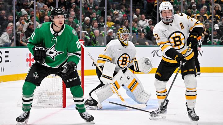 Jan 20, 2026; Dallas, Texas, USA;  Boston Bruins defenseman Charlie McAvoy (73) knocks the stick away from Dallas Stars left wing Jason Robertson (21) during the game at the American Airlines Center. Mandatory Credit: Jerome Miron-Imagn Images