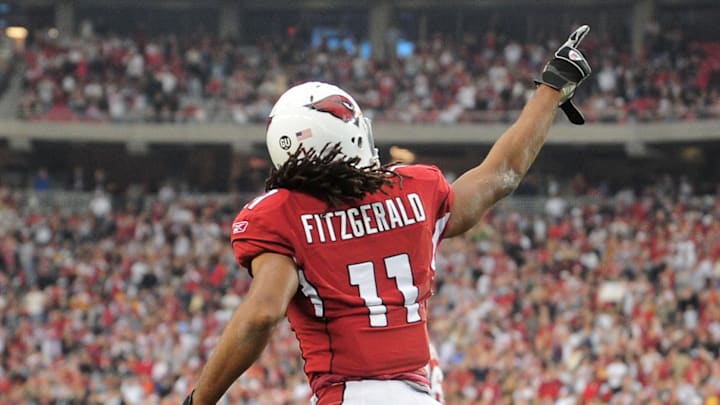 Dec. 28, 2008; Glendale, AZ, USA; Arizona Cardinals wide receiver Larry Fitzgerald celebrates a touchdown against the Seattle Seahawks at University of Phoenix Stadium. Mandatory Credit: Mark J. Rebilas-Imagn Images