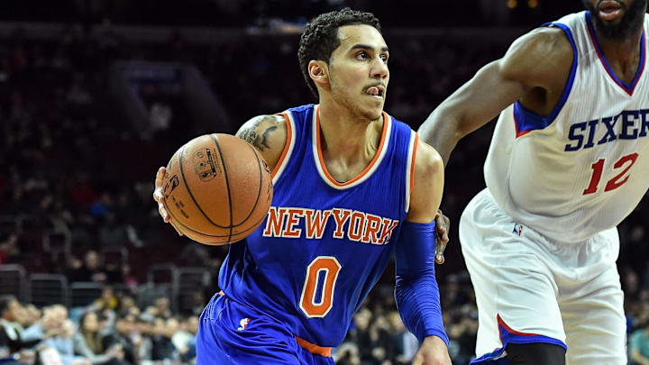 New York Knicks guard Shane Larkin moves toward the net as Philadelphia 76ers forward Luc Richard Mbah a Moute. New York Knicks guard Shane Larkin moves toward the net as Philadelphia 76ers forward Luc Richard Mbah a Moute.