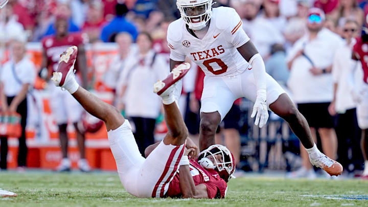 Oklahoma Sooners quarterback Michael Hawkins Jr. is sacked by Texas Longhorns linebacker Anthony Hill Jr. in OU's 34-3 loss to Texas. 