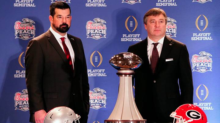 Dec 30, 2022; Atlanta, GA, USA; Ohio State Buckeyes head coach Ryan Day and Georgia Bulldogs head coach Kirby Smart pose for a photo during the coaches Peach Bowl press conference at the Westin Peachtree Plaza.
