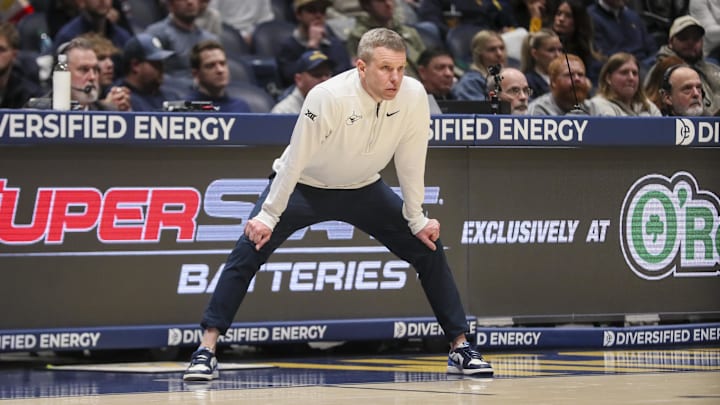 Jan 27, 2026; Morgantown, West Virginia, USA; West Virginia Mountaineers head coach Ross Hodge watches a play during the first half against the Kansas State Wildcats at Hope Coliseum. Mandatory Credit: Ben Queen-Imagn Images