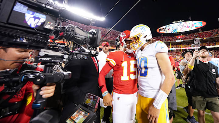 Sep 15, 2022; Kansas City, Missouri, USA; Los Angeles Chargers quarterback Justin Herbert (10) meets with Kansas City Chiefs quarterback Patrick Mahomes (15) following the game at GEHA Field at Arrowhead Stadium. Mandatory Credit: Jay Biggerstaff-Imagn Images