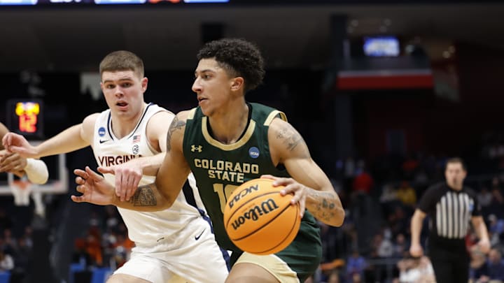 Mar 19, 2024; Dayton, OH, USA; Colorado State Rams guard Nique Clifford (10) dribbles the ball defense by Virginia Cavaliers guard Isaac McKneely (11) in the second half at UD Arena. Mandatory Credit: Rick Osentoski-Imagn Images