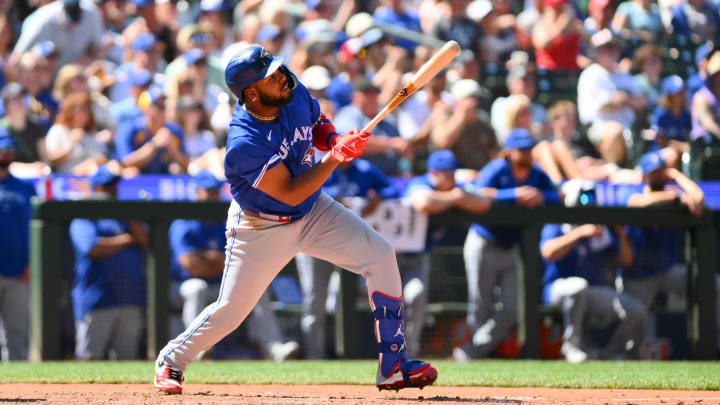 Jul 6, 2024; Seattle, Washington, USA; Toronto Blue Jays first baseman Vladimir Guerrero Jr. (27) hits an RBI sacrifice fly against the Seattle Mariners during the eighth inning at T-Mobile Park.