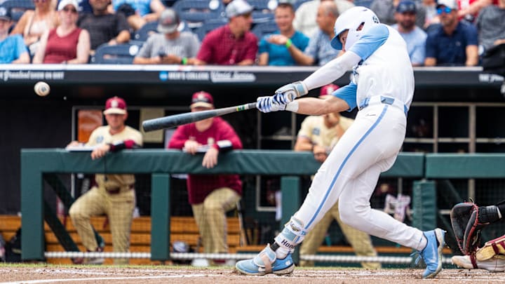 Jun 18, 2024; Omaha, NE, USA; North Carolina Tar Heels center fielder Vance Honeycutt (7) hits a double against the Florida State Seminoles during the third inning at Charles Schwab Field Omaha.