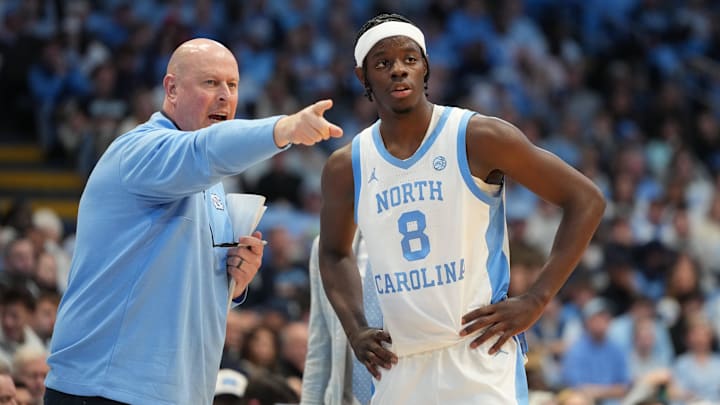 Dec 7, 2025; Chapel Hill, North Carolina, USA;  North Carolina Tar Heels assistant coach Pat Sullivan with forward Caleb Wilson (8) in the second half at Dean E. Smith Center. Mandatory Credit: Bob Donnan-Imagn Images