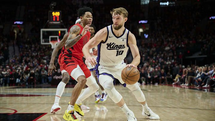 Dec 26, 2023; Portland, Oregon, USA; Sacramento Kings forward Domantas Sabonis (10) drives to the Dec 26, 2023; Portland, Oregon, USA; Sacramento Kings forward Domantas Sabonis (10) drives to the