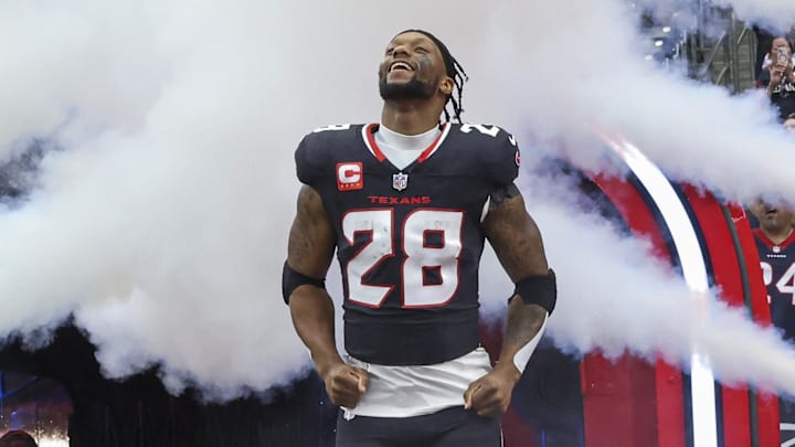 Dec 15, 2024; Houston Texans running back Joe Mixon (28) runs onto the field before the game against the Miami Dolphins at NRG Stadium. 