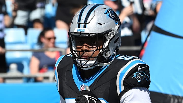 Oct 29, 2023; Charlotte, North Carolina, USA; Carolina Panthers linebacker DJ Johnson (52) runs on to the field at Bank of America Stadium. Mandatory Credit: Bob Donnan-Imagn Images