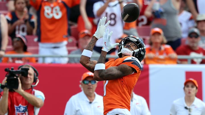 Sep 22, 2024; Tampa, Florida, USA; Denver Broncos wide receiver Josh Reynolds (11) catches the ball against the Tampa Bay Buccaneers during the first quarter at Raymond James Stadium. 