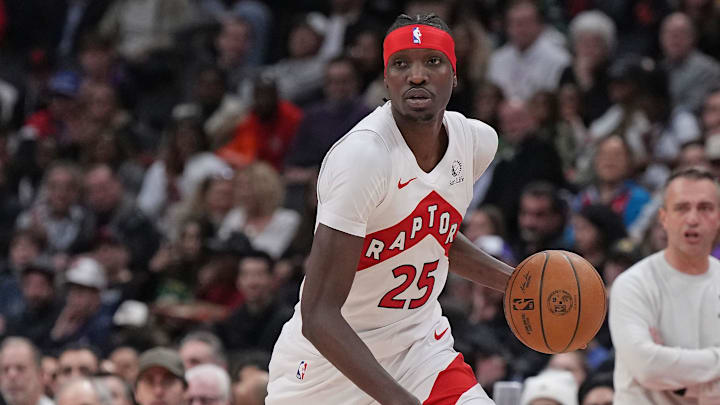 Nov 18, 2024; Toronto, Ontario, CAN; Toronto Raptors forward Chris Boucher (25) controls the ball against the Indiana Pacers during the third quarter at Scotiabank Arena. Mandatory Credit: Nick Turchiaro-Imagn Images