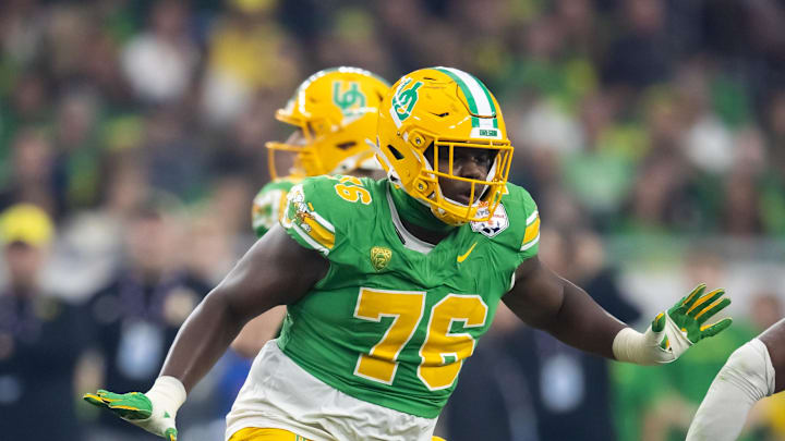 Jan 1, 2024; Glendale, AZ, USA; Oregon Ducks offensive lineman Josh Conerly Jr. (76) against the Liberty Flames during the 2024 Fiesta Bowl at State Farm Stadium. Mandatory Credit: Mark J. Rebilas-Imagn Images