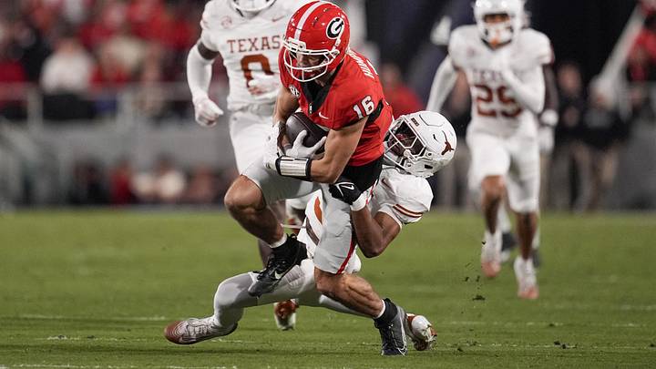 Nov 15, 2025; Athens, Georgia, USA; Texas Longhorns defensive back Jonah Williams tackles Georgia Bulldogs wide receiver London Humphreys.