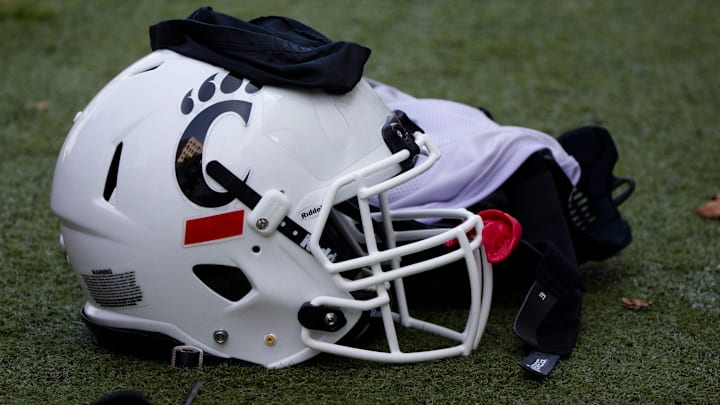 A Cincinnati Bearcats helmet and gloves sits on the turf during Cincinnati Bearcats football practice Wednesday, July 31, 2019, at the University of Cincinnati.
Cincinnati Bearcats 107 A Cincinnati Bearcats helmet and gloves sits on the turf during Cincinnati Bearcats football practice Wednesday, July 31, 2019, at the University of Cincinnati.
Cincinnati Bearcats 107