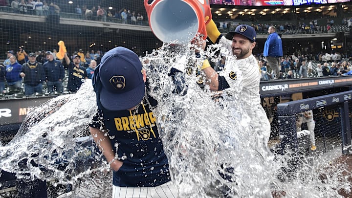 Apr 26, 2026; Milwaukee, Wisconsin, USA; Milwaukee Brewers center fielder Garrett Mitchell (5) dunks starting pitcher Kyle Harrison (52) after beating the Pittsburgh Pirates at American Family Field. Mandatory Credit: Benny Sieu-Imagn Images