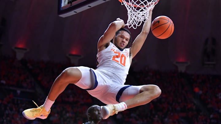 Jan 21, 2024; Champaign, Illinois, USA; Illinois Fighting Illini forward Ty Rodgers (20) dunks the ball during the first half against the Rutgers Scarlet Knights at State Farm Center. Mandatory Credit: Ron Johnson-Imagn Images