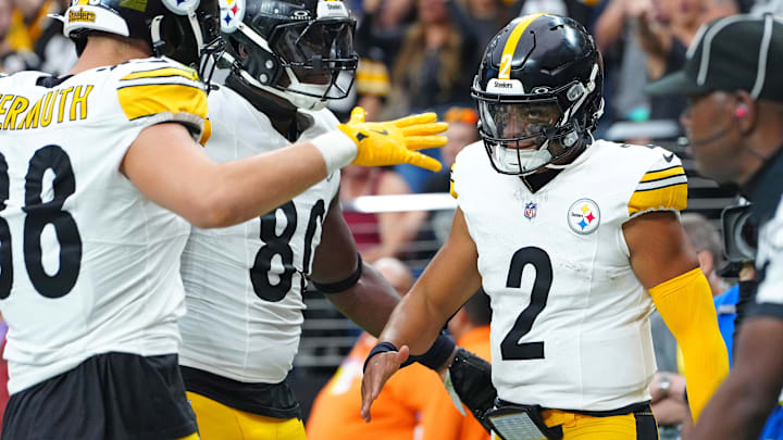 Oct 13, 2024; Paradise, Nevada, USA; Pittsburgh Steelers quarterback Justin Fields (2) celebrates with team mates after scoring a rushing touchdown against the Las Vegas Raiders during the second quarter at Allegiant Stadium. Mandatory Credit: Stephen R. Sylvanie-Imagn Images