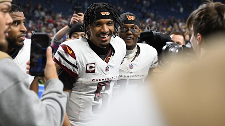 Jan 18, 2025; Detroit, Michigan, USA; Washington Commanders quarterback Jayden Daniels (5) and wide receiver Terry McLaurin (17) celebrate the win against Detroit Lions in a 2025 NFC divisional round game at Ford Field. Mandatory Credit: Lon Horwedel-Imagn Images