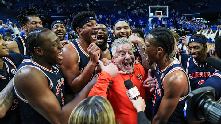 Auburn head coach Bruce Pearl and his No.1 Tigers celebrate after their 94-78 win over Kentucky -- the first win at Rupp Arena since 1988.