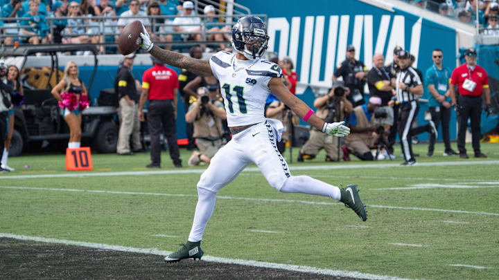 Seattle Seahawks wide receiver Jaxon Smith-Njigba (11) celebrates as he crosses the goal line after catching a touchdown pass during the second quarter in an NFL football game at EverBank Stadium, Sunday, Oct. 12, 2025, in Jacksonville, Fla. [Doug Engle/Florida Times-Union]