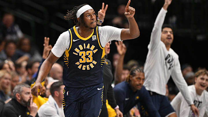 Nov 4, 2024; Dallas, Texas, USA; Indiana Pacers center Myles Turner (33) celebrates after making a three point shot against the Dallas Mavericks during the second half at the American Airlines Center. Mandatory Credit: Jerome Miron-Imagn Images