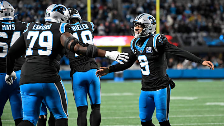 Dec 1, 2024; Charlotte, North Carolina, USA; Carolina Panthers quarterback Bryce Young (9) celebrates with offensive tackle Ikem Ekwonu (79) after the panthers score with 30 seconds left to take the lead in the fourth quarter at Bank of America Stadium. Mandatory Credit: Bob Donnan-Imagn Images