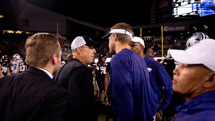 Cincinnati Bearcats head coach Scott Satterfield greets Kansas State Wildcats head coach Collin Klein after a Cincinnati Bearcats win at Nippert Stadium in Cincinnati on Saturday, September 26, 2026. Cincinnati Bearcats head coach Scott Satterfield greets Kansas State Wildcats head coach Collin Klein after a Cincinnati Bearcats win at Nippert Stadium in Cincinnati on Saturday, September 26, 2026.