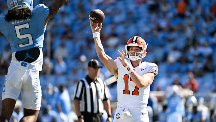 Oct 4, 2025; Chapel Hill, North Carolina, USA; Clemson Tigers quarterback Christopher Vizzina (17) passes the ball as North Carolina Tar Heels defensive back Gavin Gibson (5) pressures in the fourth quarter at Kenan Stadium. Mandatory Credit: Bob Donnan-Imagn Images Oct 4, 2025; Chapel Hill, North Carolina, USA; Clemson Tigers quarterback Christopher Vizzina (17) passes the ball as North Carolina Tar Heels defensive back Gavin Gibson (5) pressures in the fourth quarter at Kenan Stadium. Mandatory Credit: Bob Donnan-Imagn Images