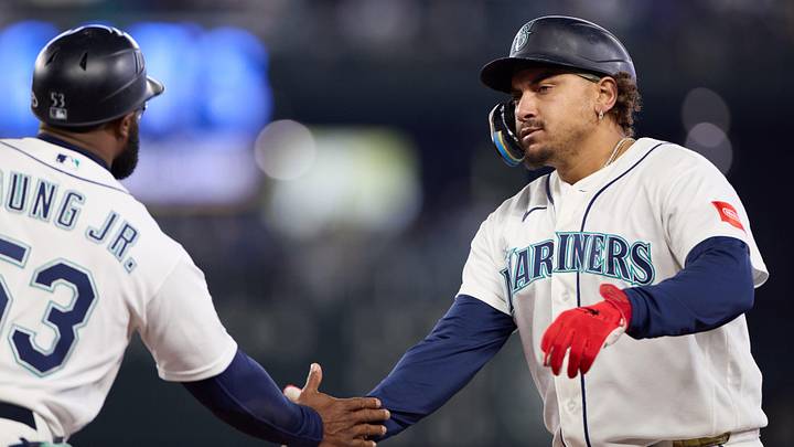 May 16, 2026; Seattle, Washington, USA; Seattle Mariners first baseman Josh Naylor (12) celebrates after hitting a single against the San Diego Padres in the fourth inning at T-Mobile Park. Mandatory Credit: Richard Dizon-Imagn Images