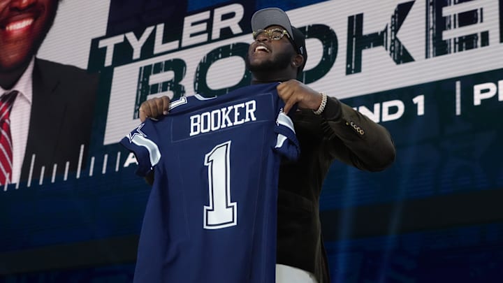 Alabama Crimson Tide G Tyler Booker is selected by the Dallas Cowboys in the first round of the 2025 NFL Draft at Lambeau Field.