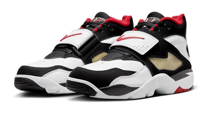 The Nike Air Diamond Turf in the "Fire Red and Metallic Gold" colorway. The Nike Air Diamond Turf in the "Fire Red and Metallic Gold" colorway.