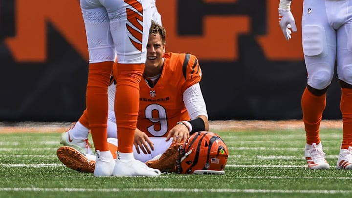 Sep 14, 2025; Cincinnati, Ohio, USA; Cincinnati Bengals quarterback Joe Burrow (9) sits on the ground after a play in the first half against the Jacksonville Jaguars at Paycor Stadium. Mandatory Credit: Katie Stratman-Imagn Images